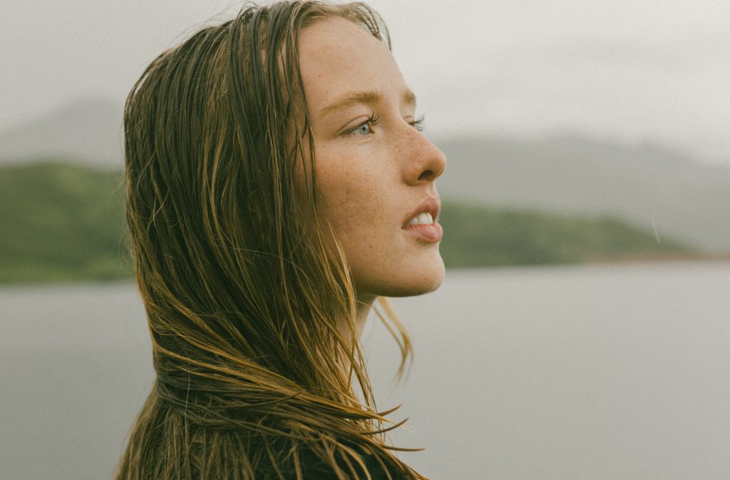 Close up portrait in front of lake