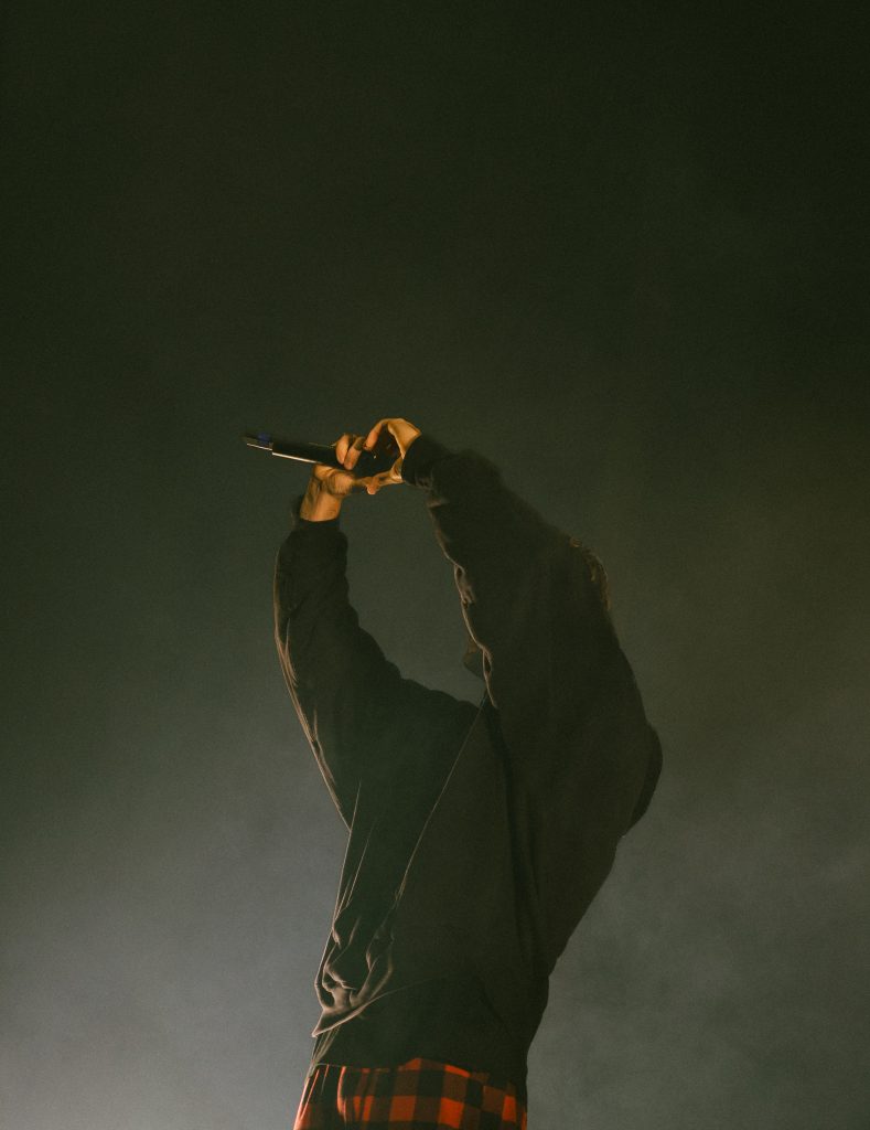 JVKE holding heart sign while performing at the Complex